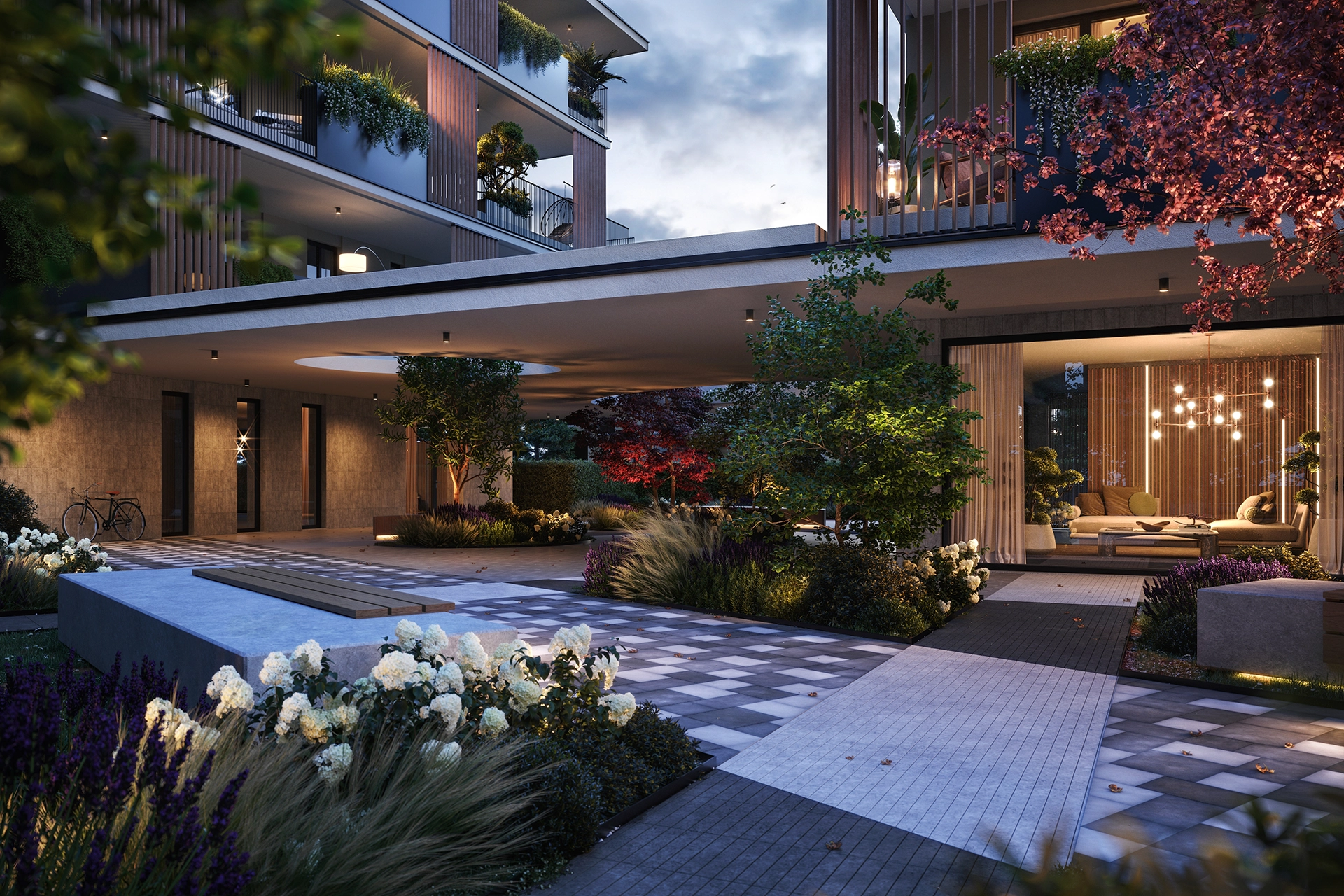 Vista esterna serale del progetto residenziale Dimore dei Colli con corte centrale e facciata moderna